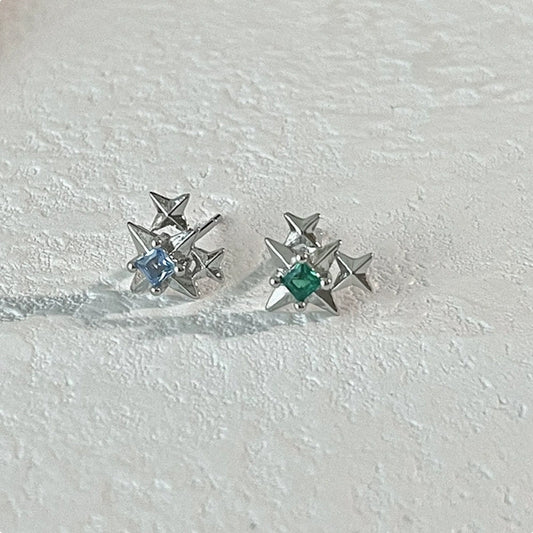 Green and blue earrings inlaid with zircon Arctic stars